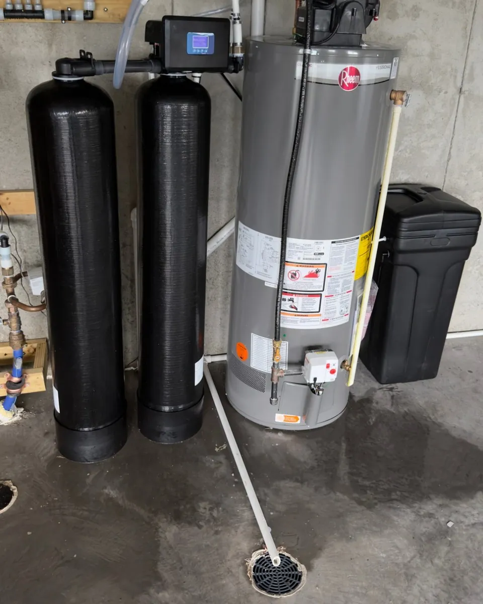 Dual tank whole-home system installed by MSP Pure Water beside a water heater