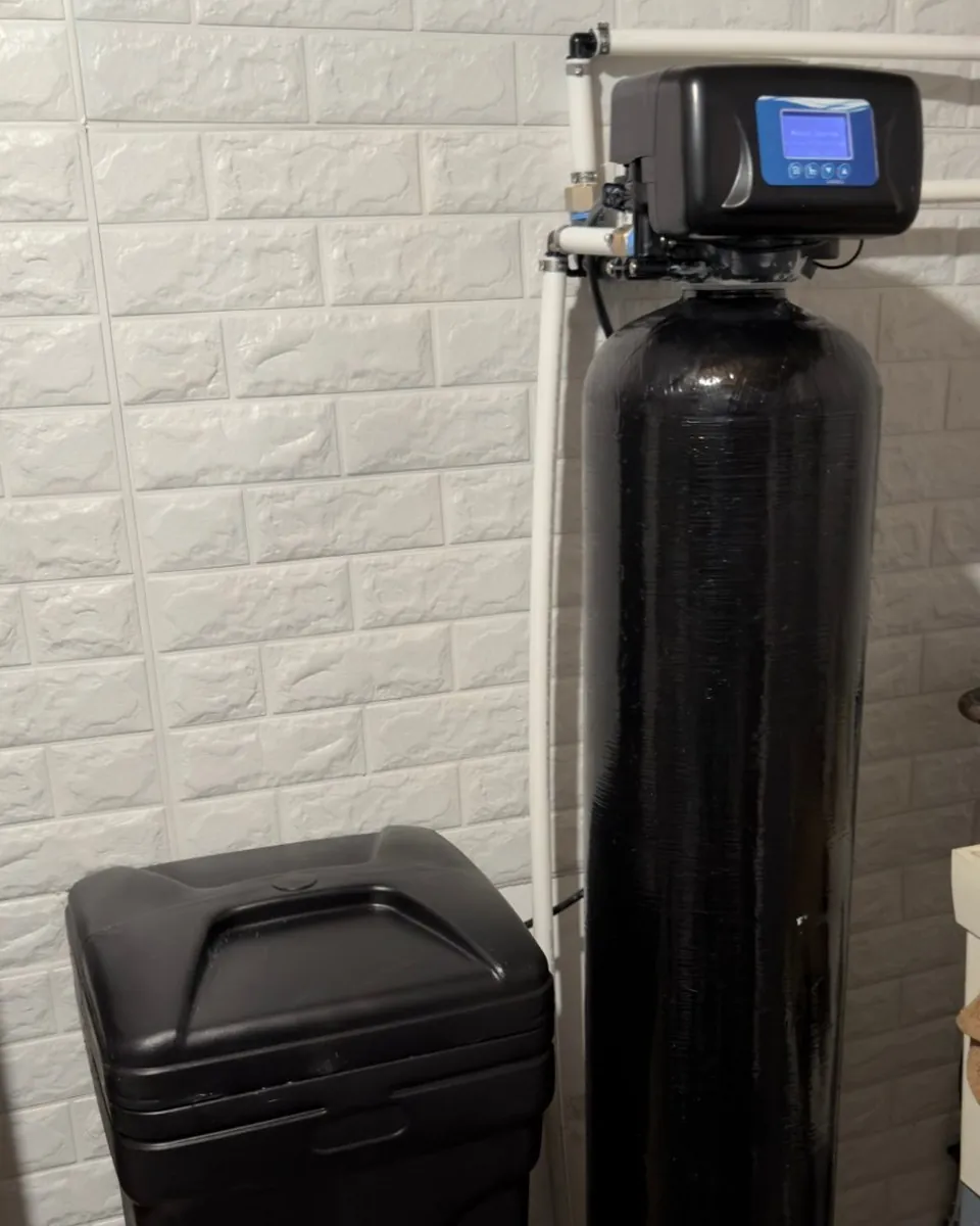 Whole-home water softener and brine tank installed by MSP Pure Water next to the home's main water line
